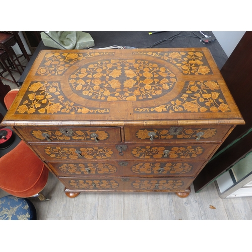 6001 - An 18th Century chest of two short over three graduated long drawers, floral inlay, bun feet with ke... 