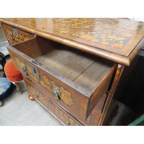 6001 - An 18th Century chest of two short over three graduated long drawers, floral inlay, bun feet with ke... 