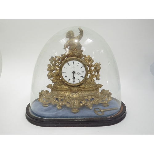 6036 - A late 19th century French gilt clock surmounted by a figure with grape bush detail. White enamel ro... 