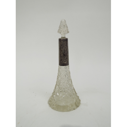 6377 - A cut glass silver collared scent bottle, slight nibbles to glass, 22cm tall