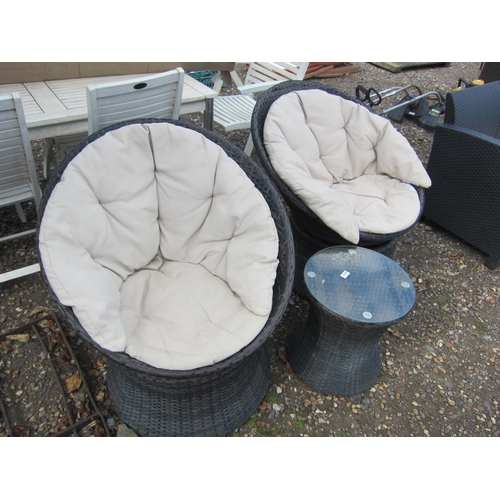 3315 - Two rattan swivel garden chairs and table