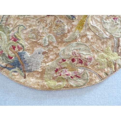 6053 - A Georgian oval stump work panel, birds foliage multiple areas of damage, 98cm x 80cm