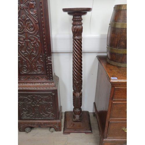 6047 - A 19th Century carved mahogany column torchere, with acanthus-capped wrythen-fluted stem, on a squar... 