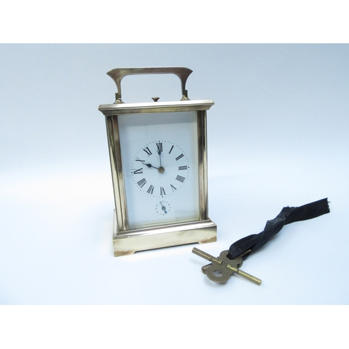 6279 - A French repeater carriage clock, enamel face with Roman numeral dial, two keys