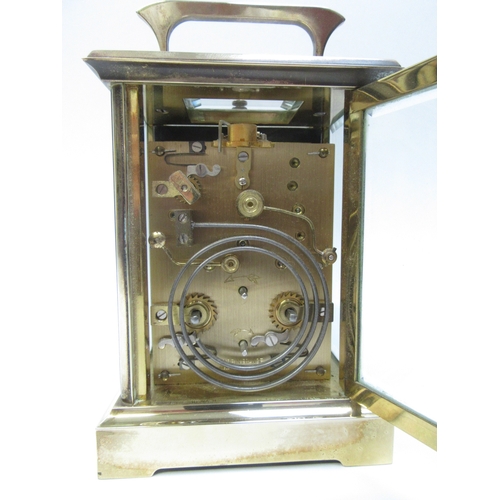 6279 - A French repeater carriage clock, enamel face with Roman numeral dial, two keys