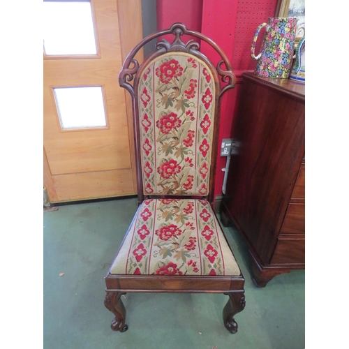 4031 - A circa 1830 rosewood hall chair with carved backrest, the needlepoint upholstery over carved cabrio... 