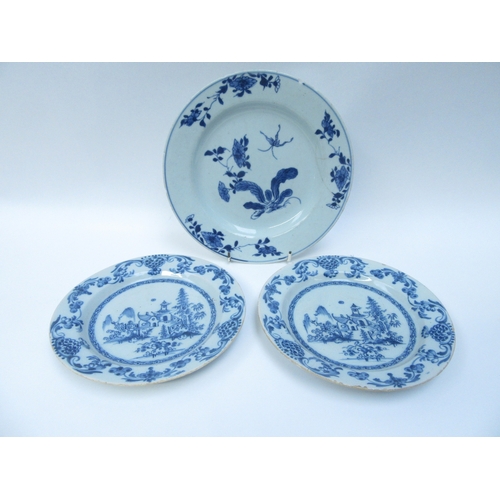 6010 - A pair of Oriental blue and white tin glazed plates with central image of dwelling and gardens and a... 