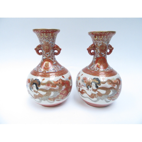 6257 - A pair of Japanese Kutani vases with elephant  detail to necks, the bodies decorated with immortal s... 