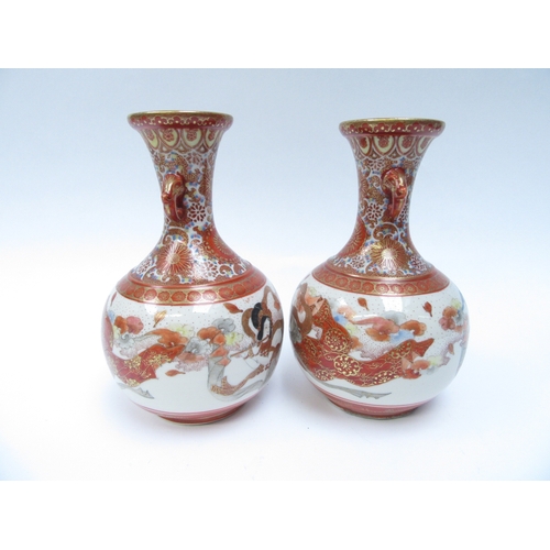 6257 - A pair of Japanese Kutani vases with elephant  detail to necks, the bodies decorated with immortal s... 