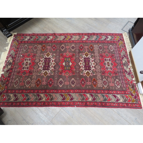 6456 - A Persian rug of geometric designs 198cm x 126cm