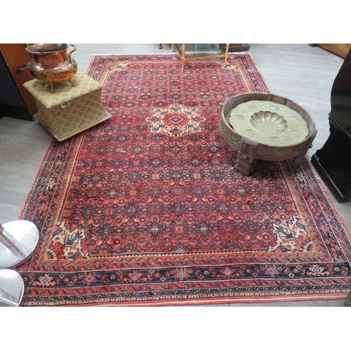 6465 - A handwoven Persian rug with central medallion, 317cm x 210cm