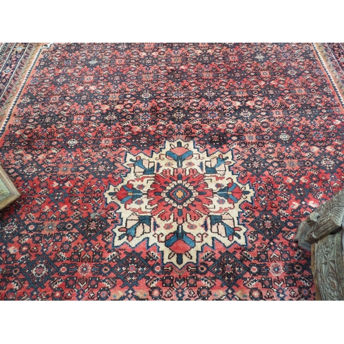 6465 - A handwoven Persian rug with central medallion, 317cm x 210cm