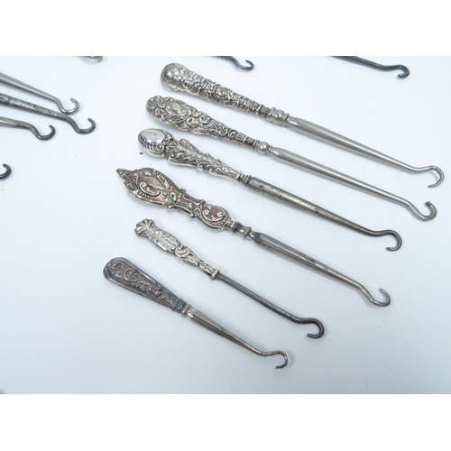 6387 - A good quantity of silver handled button hooks various sizes