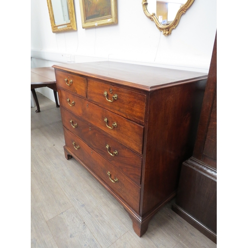 6063 - Probably Scottish, a George III flame mahogany chest of two short over three graduating long drawers... 