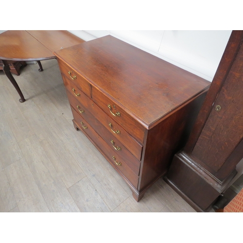 6063 - Probably Scottish, a George III flame mahogany chest of two short over three graduating long drawers... 