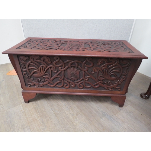 6073 - An Arts and Crafts late Victorian heavily carved walnut chest with intertwined dragon decoration the... 