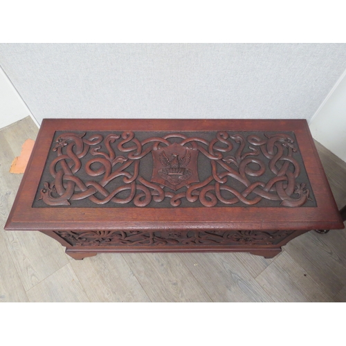 6073 - An Arts and Crafts late Victorian heavily carved walnut chest with intertwined dragon decoration the... 