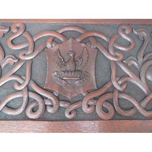 6073 - An Arts and Crafts late Victorian heavily carved walnut chest with intertwined dragon decoration the... 