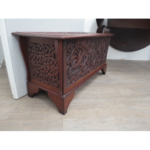 6073 - An Arts and Crafts late Victorian heavily carved walnut chest with intertwined dragon decoration the... 