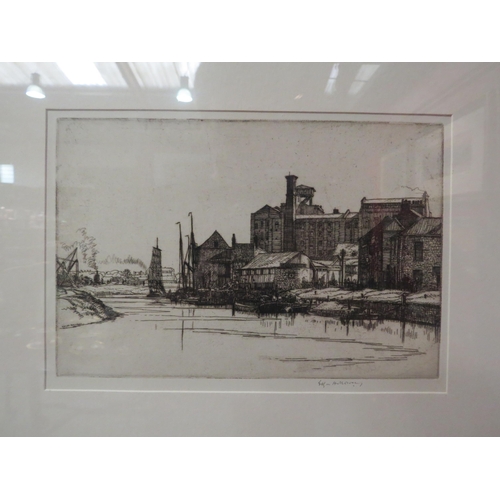 4040 - EDGAR HOLLOWAY (1914-2008): A framed and glazed etching, canal boats beside industrial buildings.  P... 