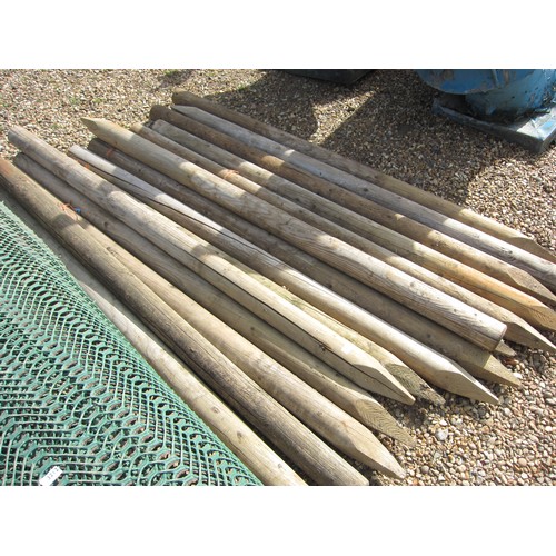 3213 - A quantity of round timber fence posts