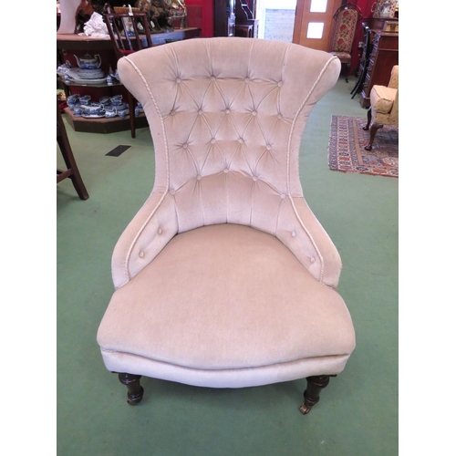 4092 - A circa 1860 armchair, the buttoned and waisted shape backrest over turned and tapering fore legs on... 