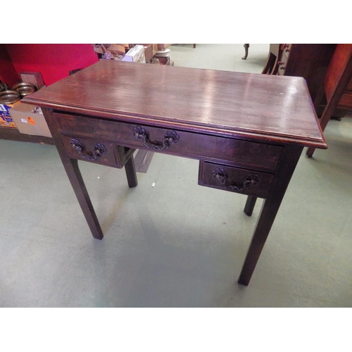 4101 - A George III walnut and oak lowboy, the single long drawer over two short drawers with bronze grape ... 