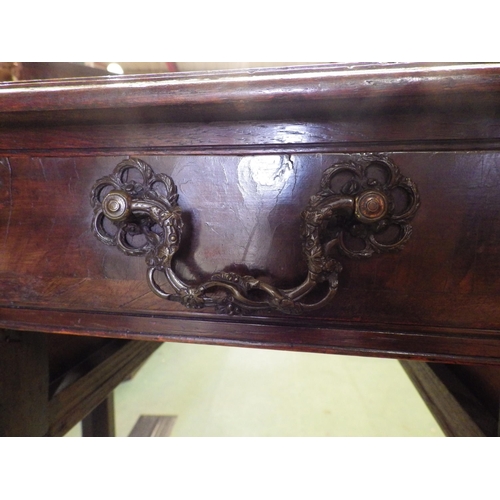 4101 - A George III walnut and oak lowboy, the single long drawer over two short drawers with bronze grape ... 