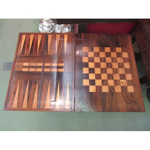 4115 - A circa 1840 rosewood games table the fold-over swivel top with inlaid backgammon/chess and cribbage... 