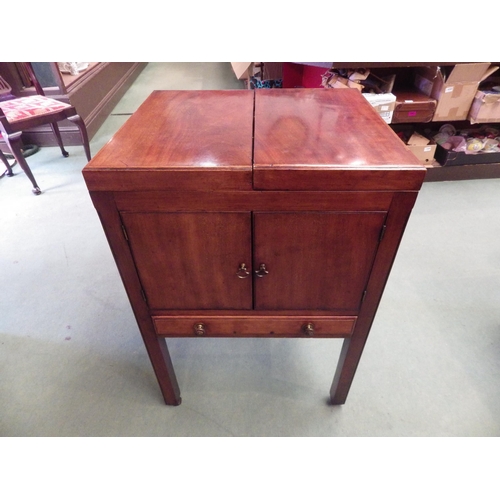 4122 - A George III flame mahogany washstand, the hinged top and wash basin over a two door cupboard and si... 