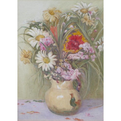 1052 - A framed and glazed watercolour still life, ceramic jug of flowers. Unsigned. Image size 33.5cm x 24... 