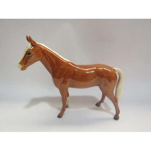 4313 - A Goebel figure of a Palomino horse, 22cm tall