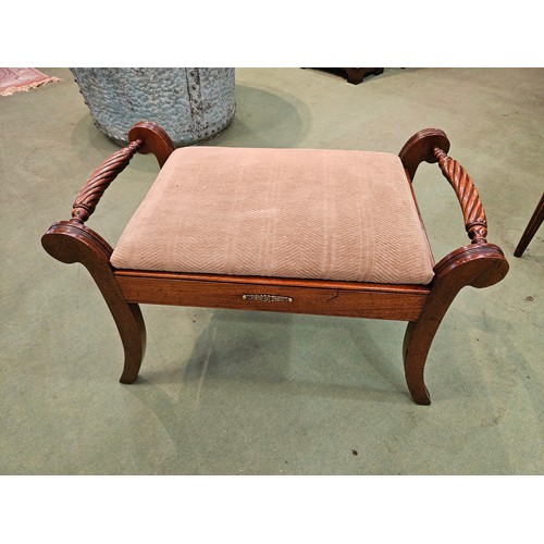 4276 - A Georgian mahogany upholstered hinged seat stool with carved rope-twist handles on reeded, scroll t... 