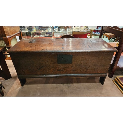 4285 - A 17th Century oak coffer of small proportions, the iron hinged lid over arch end supports, 40cm tal... 