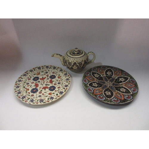 4321 - Three Thoune Swiss ceramic wares, two plates and a teapot (chip to lid), together with a red glazed ... 