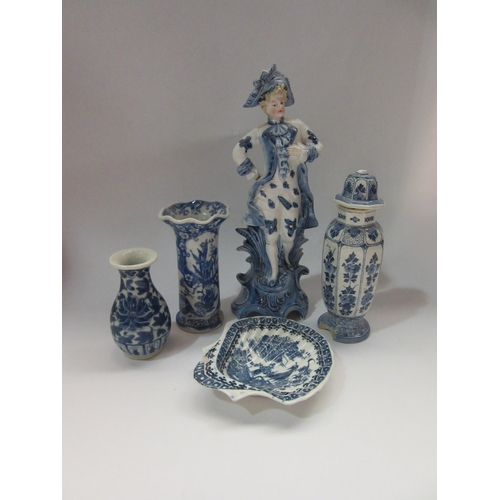 4323 - Five blue and white ornamental ceramics including vases, shell form dish and a figure of a gentleman... 