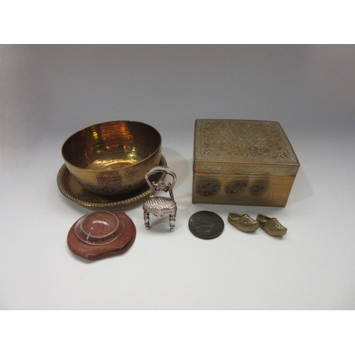 4357 - Three engraved brass items including a plate, bowl and box, with some miniature items.