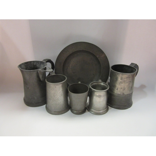 4366 - A group of English pewter tankards and a plate, one with a spout