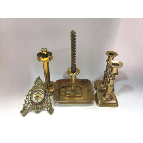 4373 - Four brass candlesticks, one a chamber candlestick and another labelled Palmer & Co. Together with a... 