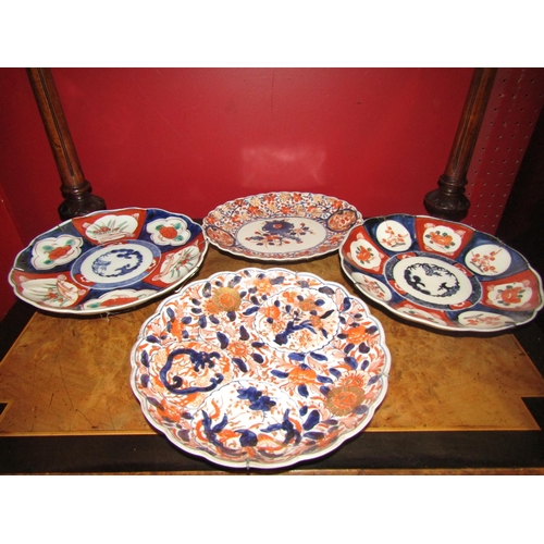 4072 - Seven assorted Japanese Imari dishes, largest 31cm diameter