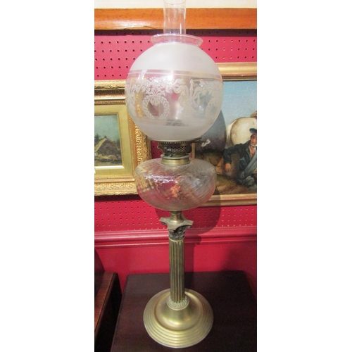 4108 - A brass Corinthian column oil lamp with etched floral and swag design shade