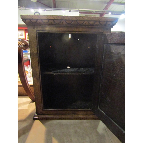 4274 - An 18th Century oak single door wall cupboard with carved door having iron 