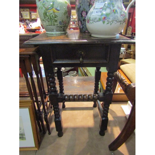 4279 - A 19th Century lamp/hall table, the single frieze drawer over turned bobbin/square legs united by st... 