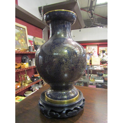 4289 - A 20th Century cloisonne vase on stand, dent to back, 23.5cm tall