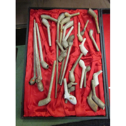 4304 - A quantity of tobacco related items to include various pipes and pipe ends, along with two associate... 