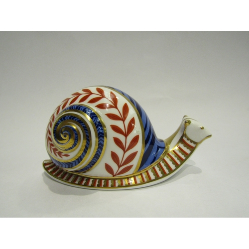 4411 - A Royal Crown Derby Snail paperweight, gold stopper, 6cm tall