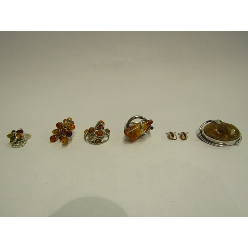 4424 - Two amber pendants, amber brooch, amber ring etc.