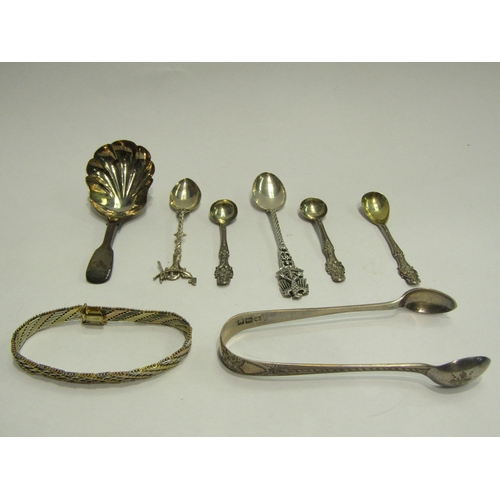 4435 - A small quantity of silver items including sugar nips, caddy spoon and bracelet