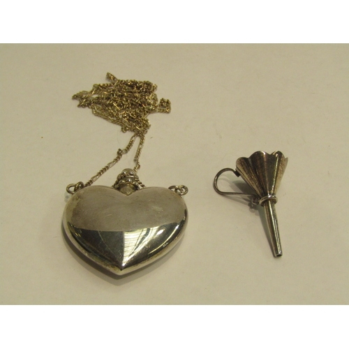 4436 - WITHDRAWN; A silver heart shaped scent bottle pendant on a silver chain, with a silver miniature fun... 