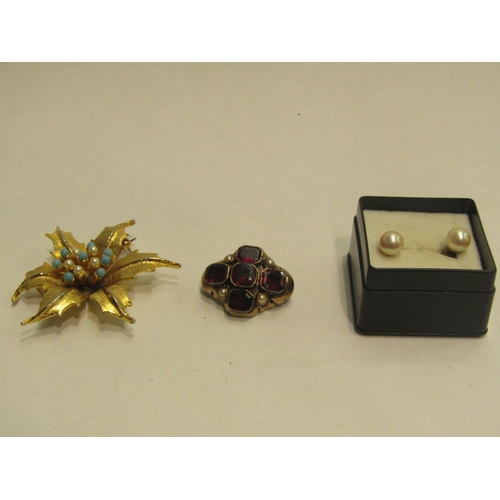 4447 - A garnet set brooch, floral brooch and pair of pearl earrings